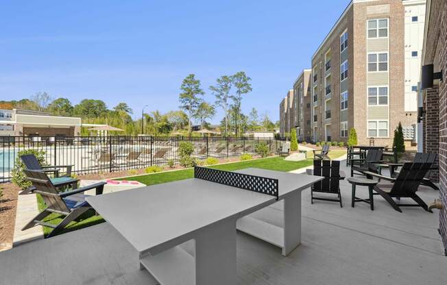 A table and chairs are set up on a patio.