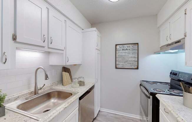 A kitchen with a sign that says Kitchen Rules.