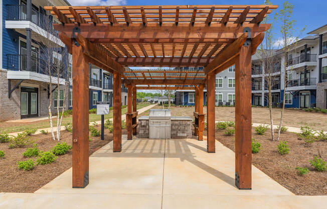 a covered patio with a fountain in the middle of an apartment building