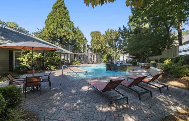 Pool lounge chairs at Park Summit Apartments in Decatur, GA 30033