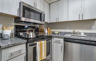 Renovated Kitchen with stainless steel appliances and granite countertops at Elme Manassas, Virginia