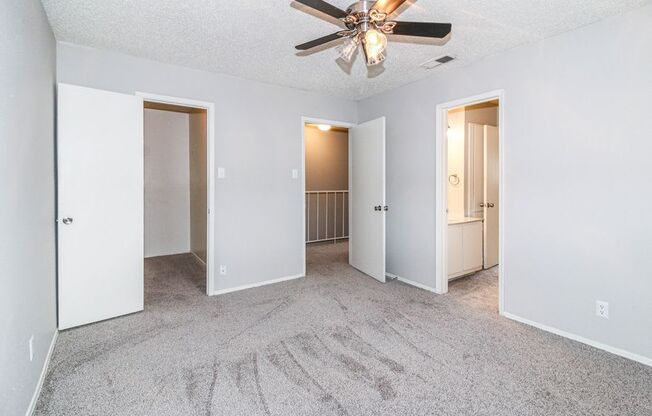 a view of a ceiling with a group of ceiling fans