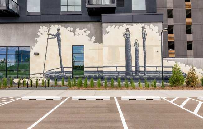 a mural of three women on the side of a building