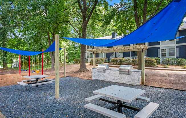 our apartments have a community picnic area with tables and chairs