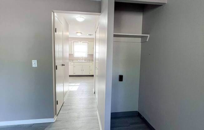 a view of the hallway from the living room into the kitchen