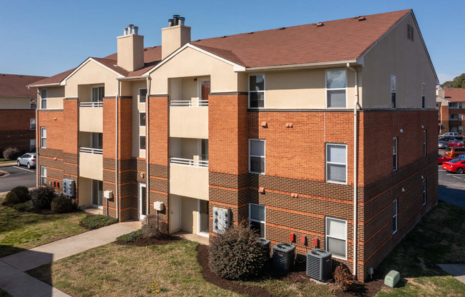 an exterior view of a brick apartment building