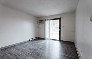 A room with a sliding glass door and a window. at Bristol Ridge, Urbandale