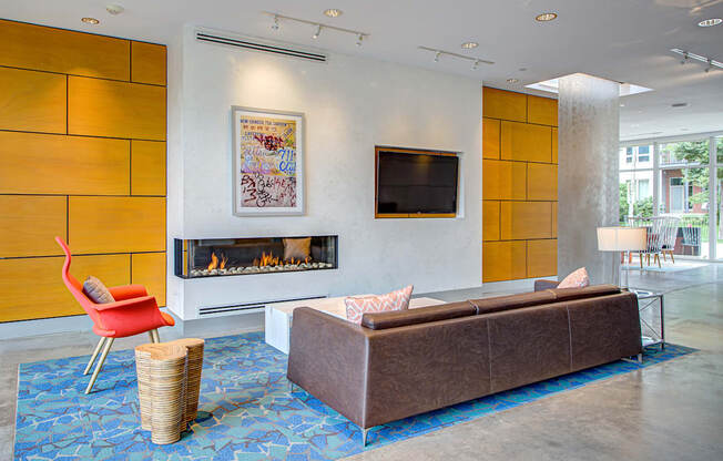 A living room with a fireplace, a couch, and a television.