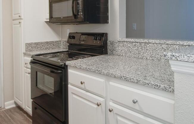 Fully-equipped Kitchen at Madison Landing at Research Park Apartments in Madison, Alabama