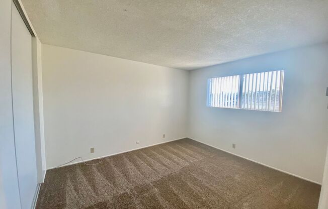 Upper Corner Unit with Utilities INCLUDED!!