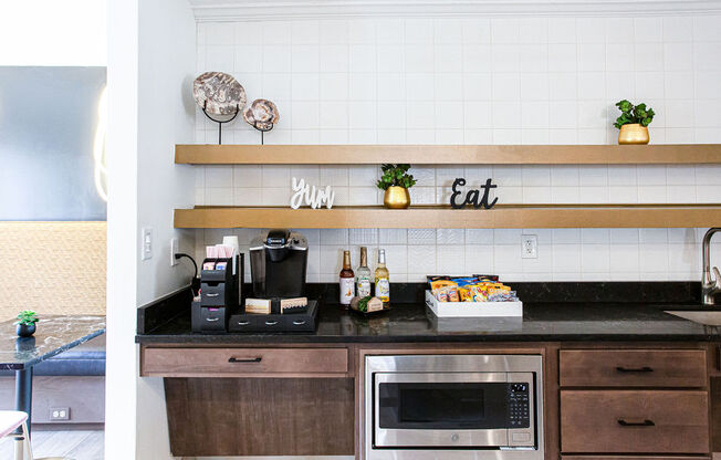 a kitchen with a counter top and a microwave