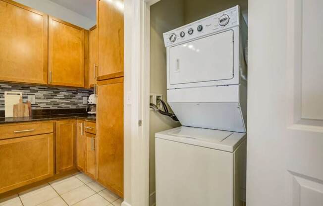 A white oven is built into a wall in a kitchen.