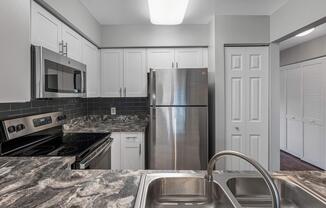 a modern kitchen with stainless steel appliances