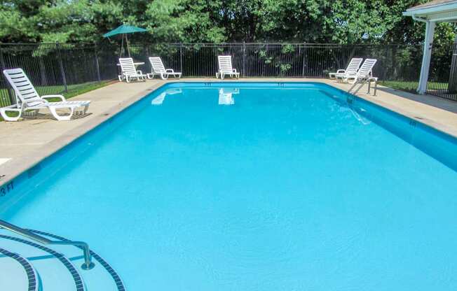 Pool with lounge chairs at Cobblestone Corners Apartment Homes, Nashville, 37216