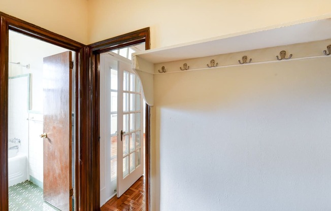 view of bathroom and custom shelving in hallway of eddystone apartments in washington dc