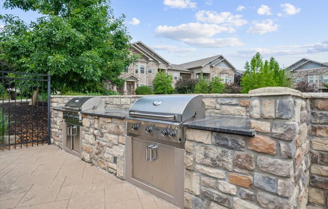 A stone wall with a grill on top.