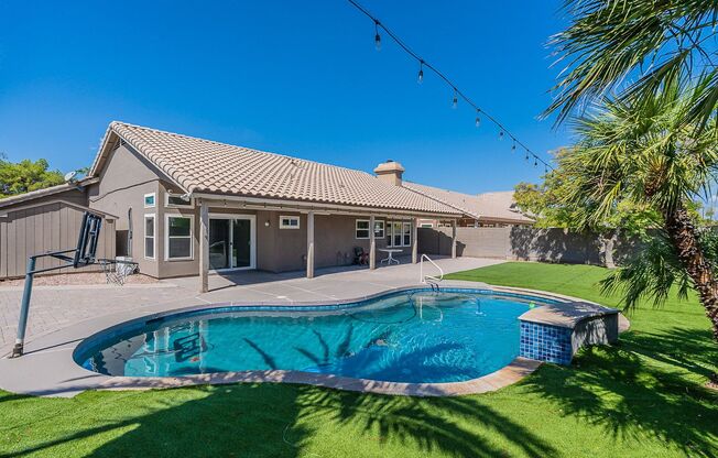 Charming 4-Bedroom Home with Luxurious Pool & Outdoor Living Space