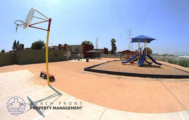 a playground with a swing set and a basketball court