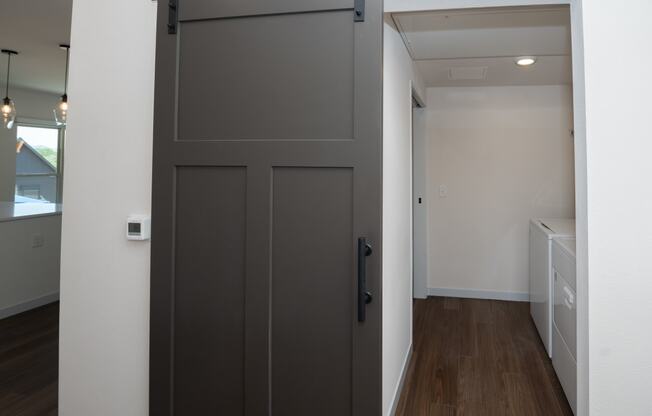 a large grey door in a room with a hallway at The Crossings at Windsong, Arizona