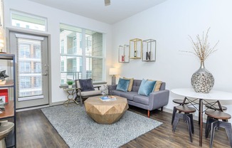 a living room with a couch and a round coffee table