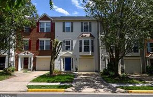 Beautifully updated townhome with an attached one-car garage.