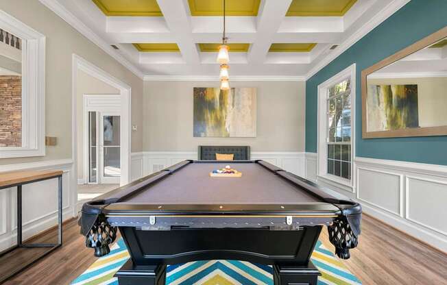 a billiards room with a pool table