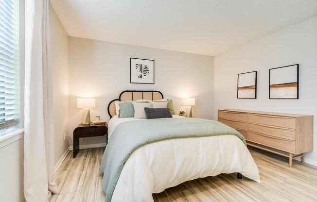 Bed and furniture inside platinum bedroom interior at The Arbor in Blue Springs, Missouri