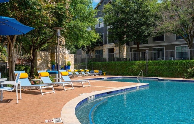 pool side with lounge chairs