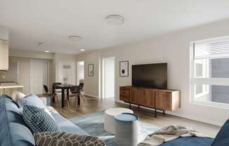 A modern living room with a blue sofa and a television.