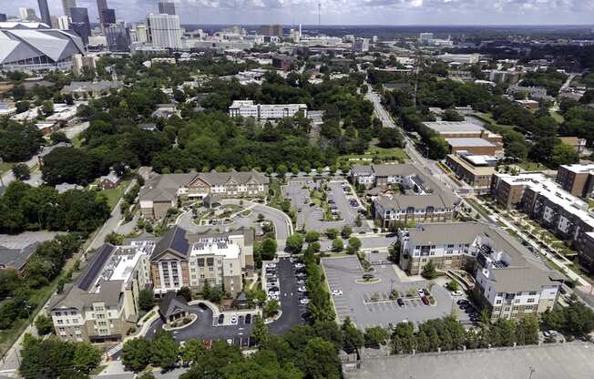 A bird's eye view of a city with a mix of residential and commercial buildings.