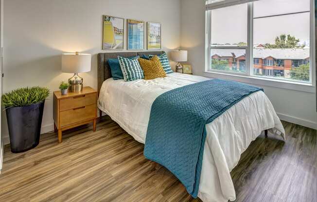 bedroom with green and white comforter at Brixton South Shore, Austin, 78741