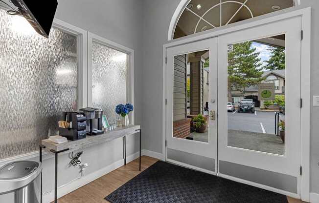 a bathroom with a sink and a glass door