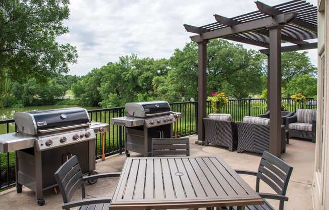 Outdoor patio with gas grills and seating