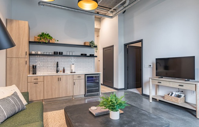 a living room with a couch and a tv