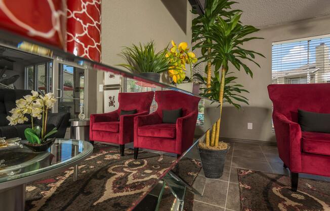 a living room filled with furniture and vase of flowers on a table