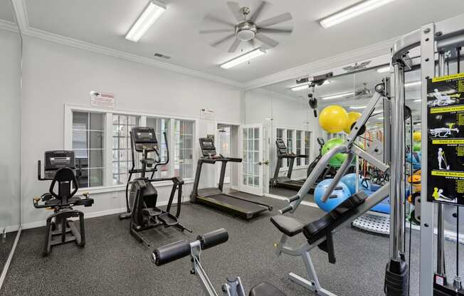 A well-equipped gym with various exercise machines and equipment.