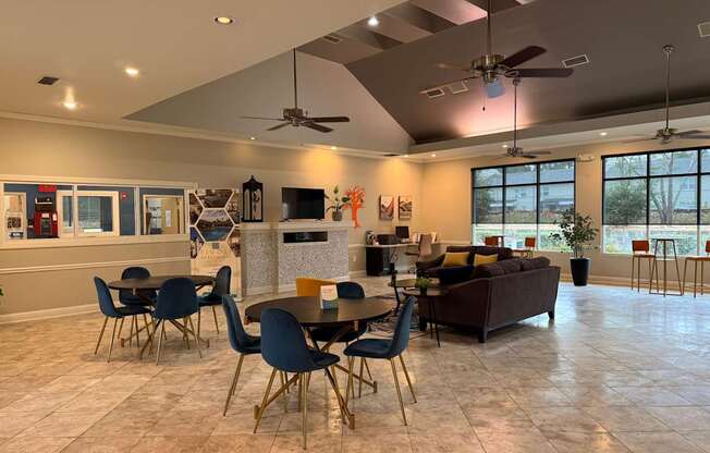 A modern dining room with a large table and chairs.