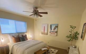 an overhead view of a bedroom with a bed and a ceiling fan at Bowles Apts, Azusa California