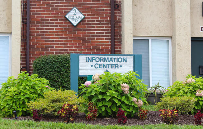 a sign in front of a building that says information center