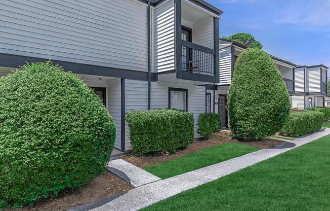 a green lawn in front of a building