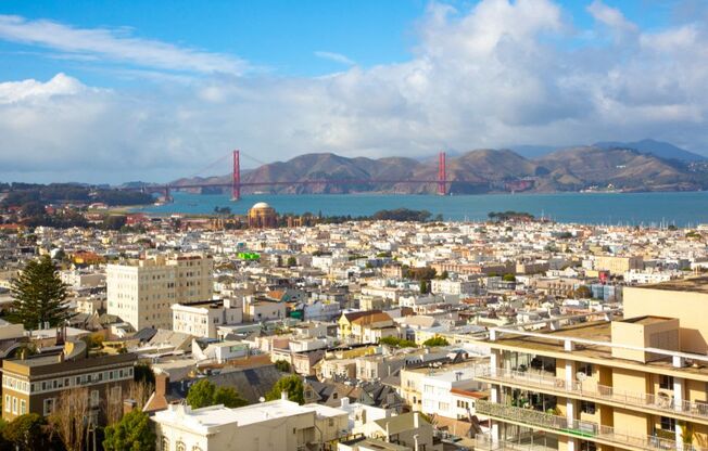 a view of the san francisco skyline with the golden gate bridge in the background