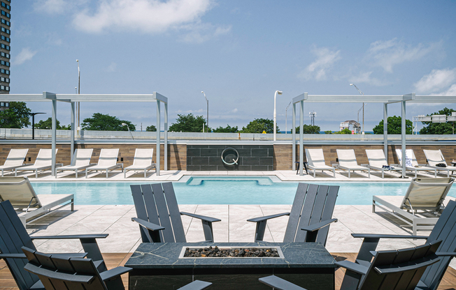 Quarter residents enjoy a heated zero-edge pool with cabanas and grills on a raised deck