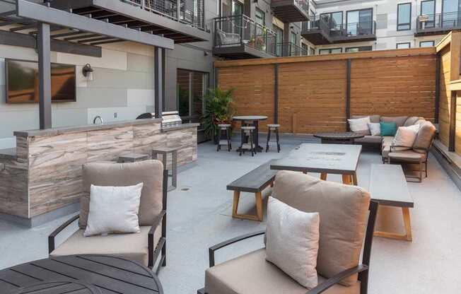 A patio with a table and chairs.