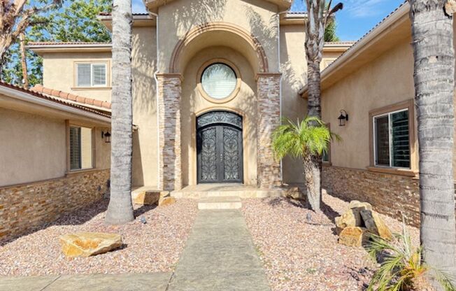Gated estate with a backyard oasis