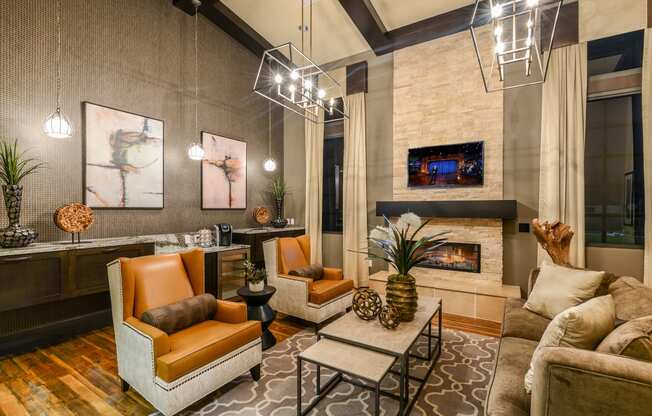 Sitting area with a fireplace in the clubhouse at Palm Ranch Apartments in Davie, FL