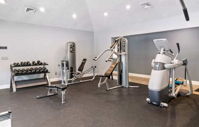 A gym with a variety of equipment at Ridge Crossings Apartments, Hoover, Alabama