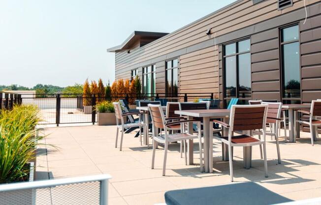 a patio with tables and chairs on a roof at Barrington 101, Illinois, 60010