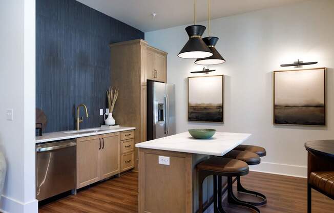 A kitchen with a white counter top and wooden cabinets.