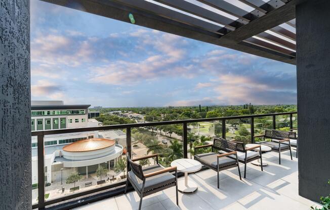 Covered rooftop overlook with lounge seating and sweeping Coral Springs views, offering a relaxed perch for morning coffee or evening conversations.
