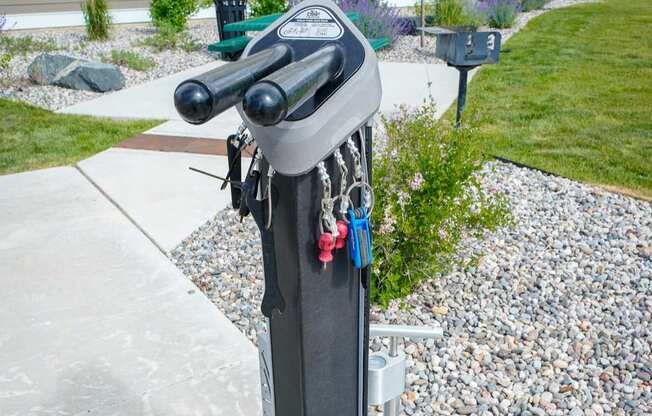 A bike rack with a bike locked to it.